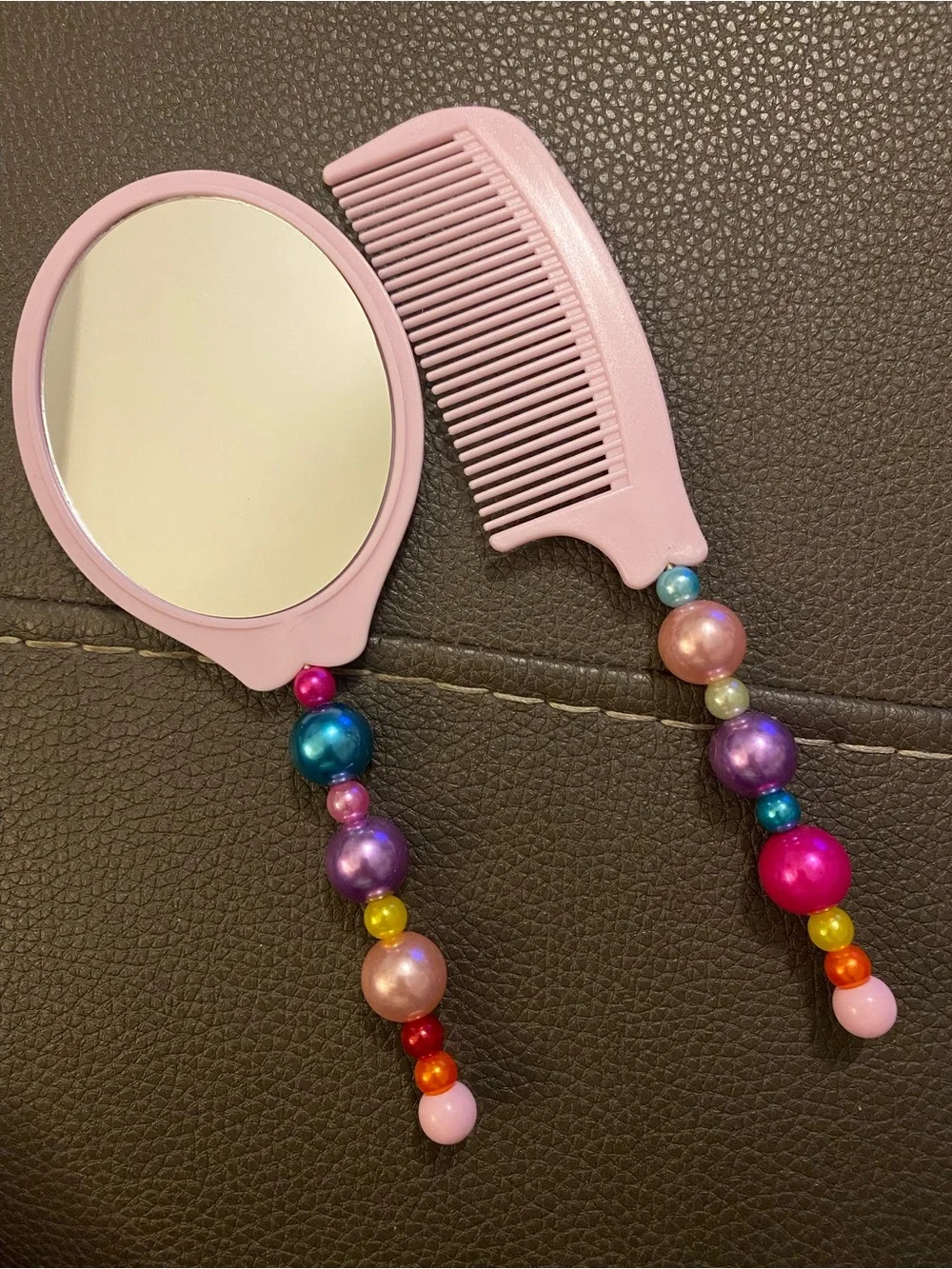 Pink Beaded Handle Hairbrush and Comb Set.